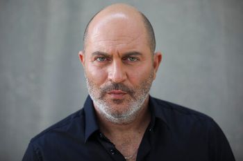 In this Thursday, May 30, 2019 photo, one of the creators of Israel's hit TV show "Fauda" Lior Raz poses for a photo in Tel Aviv, Israel.