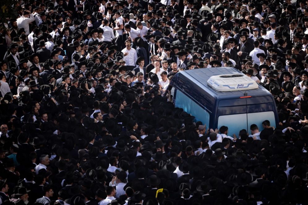 Ultra-Orthodox Jews attend the funeral of Rabbi Shalom Cohen, the spiritual leader of Shas, in Jerusalem, on August 22, 2022.