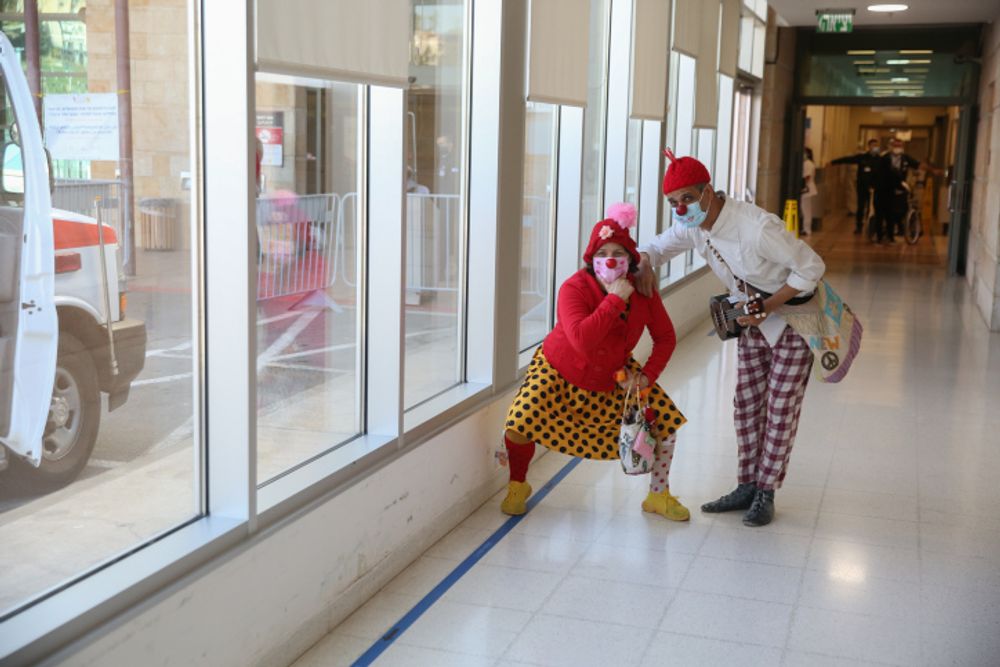 Medical clowns are seen at the Ziv medical center in the northern Israeli city of Tzfat.