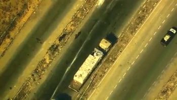 Hamas terrorists commandeering and looting an aid track in Gaza  