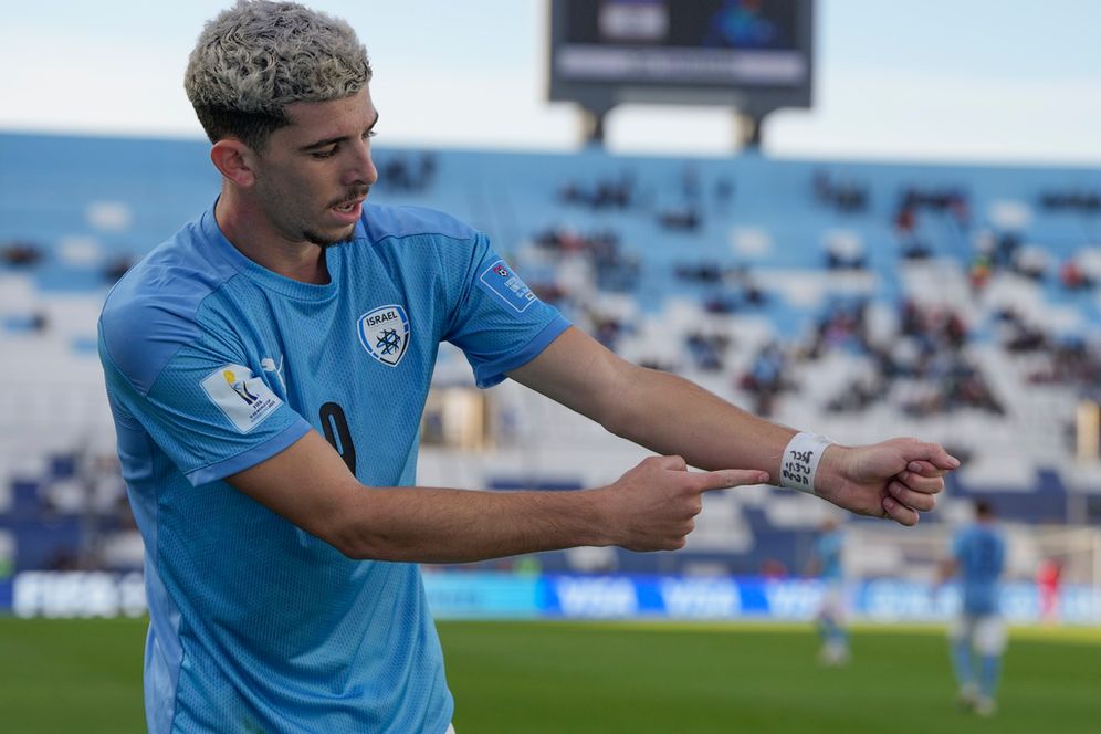 Israel's Dor Turgeman celebrates after scoring his side's third goal during the extra time of a FIFA U-20 World Cup quarterfinal soccer match against Brazil, at the Bicentenario stadium in San Juan, Argentina,
