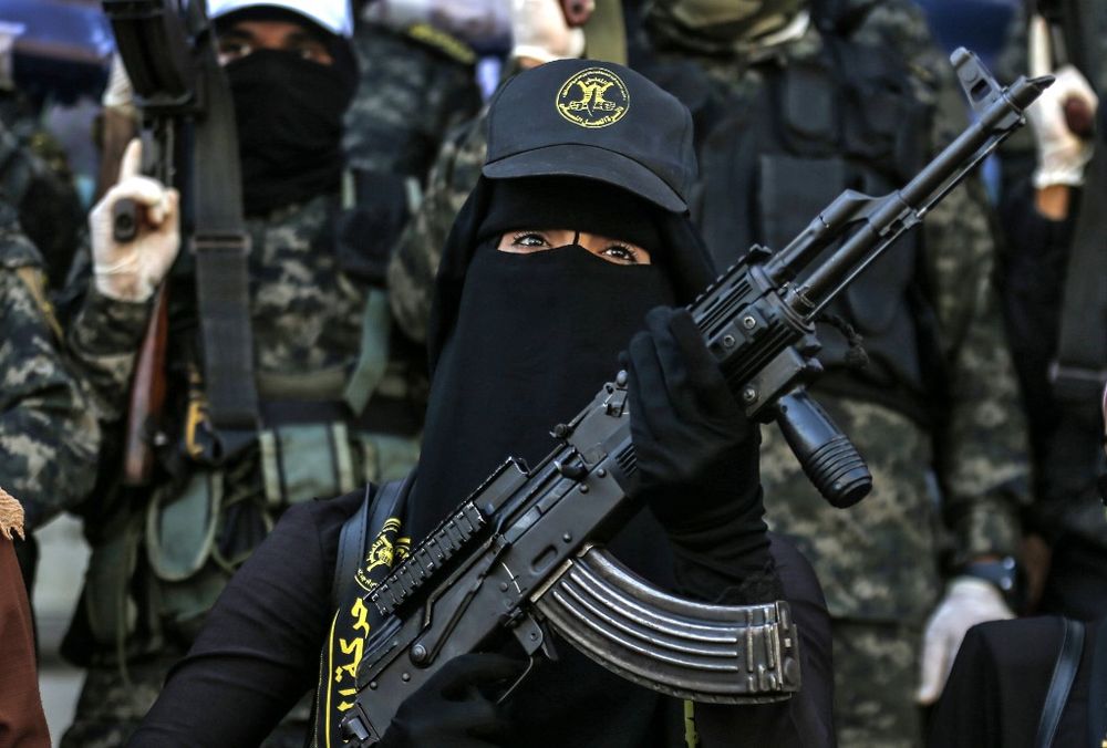 Palestinian supporters and members of the Islamic Jihad group take part in a rally marking the 33rd anniversary of the organization's founding, in Rafah, in the southern Gaza Strip, on October 6, 2020.
