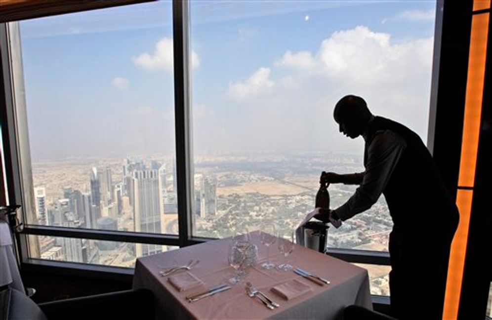 A bar captain places a bottle of champagne at a restaurant in Dubai, United Arab Emirates, on January 23, 2011.