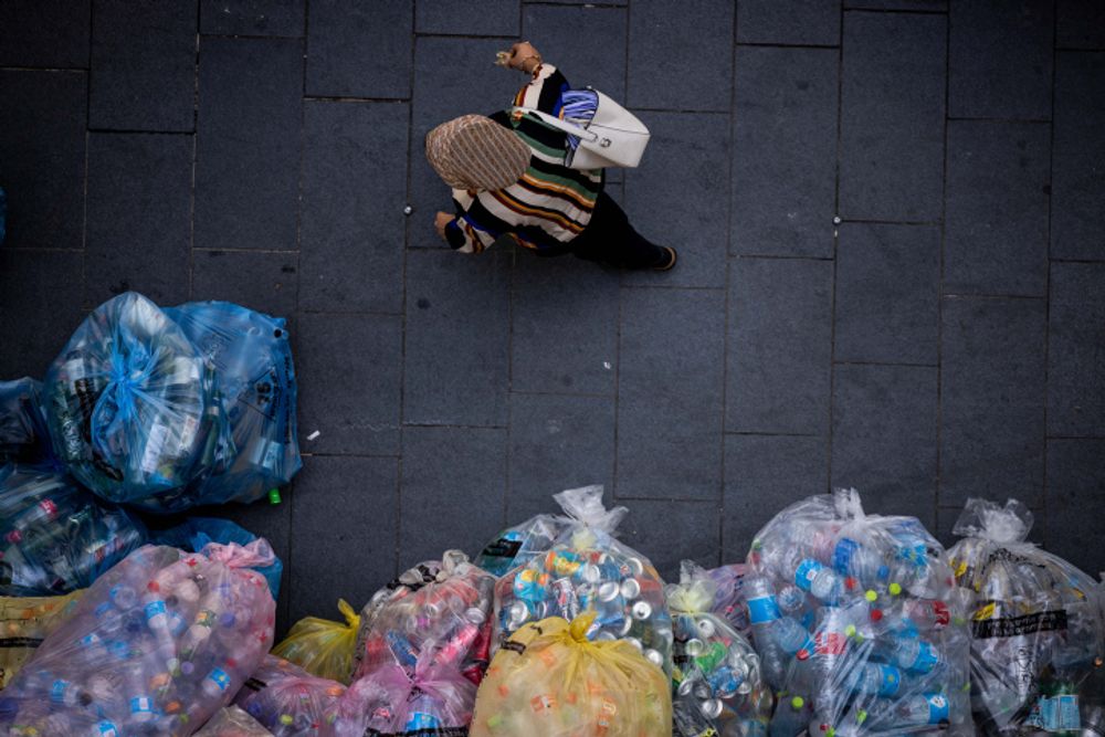 Plastic bags with bottles for recycling in Jerusalem.