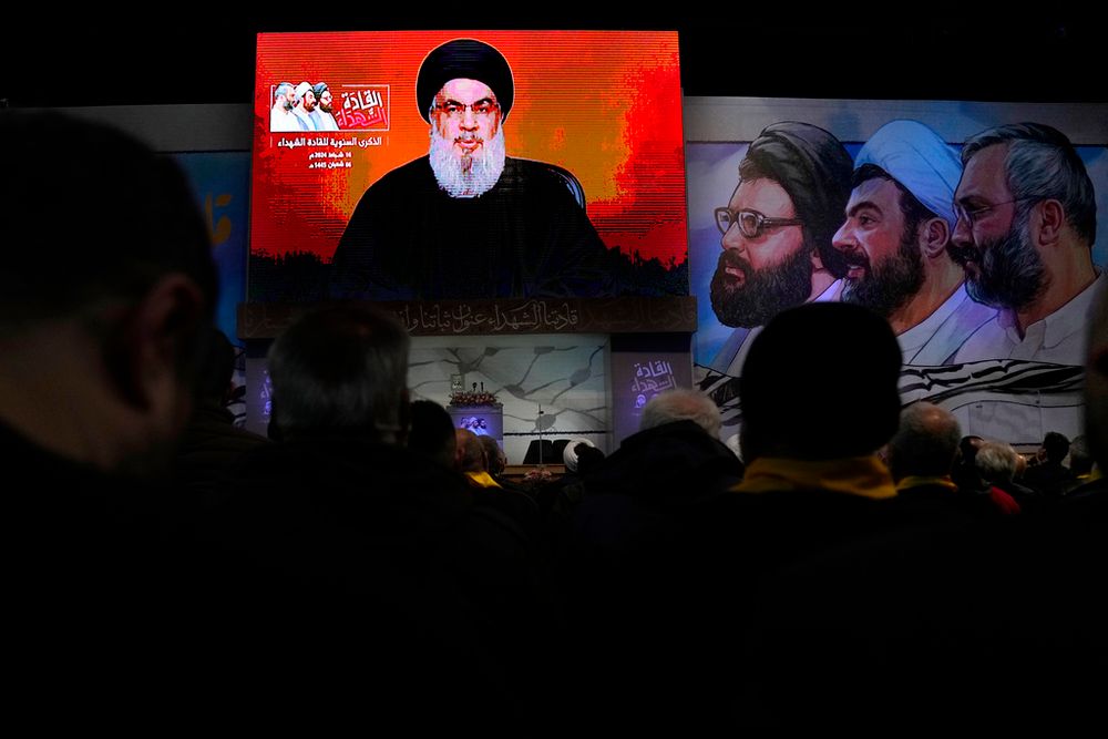 Hezbollah leader Sayyed Hassan Nasrallah speaks on a screen via a video link during a ceremony to mark the anniversary of the death of Hezbollah leaders, in the southern suburbs of Beirut, Lebanon.
