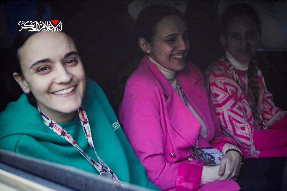 The Israeli hostages Emily Damari, Romi Gonen and Doron Steinbracher, sit in a Hamas vehicle before being handed over to the Red Cross in the Gaza Strip on January 19, 2025