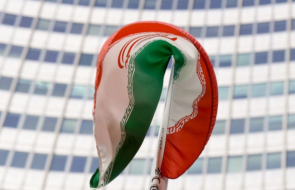 The Iranian national flag creases outside the International Atomic Energy Agency (IAEA) headquarters during the agency's Board of Governors meeting in Vienna on March 1, 2021.