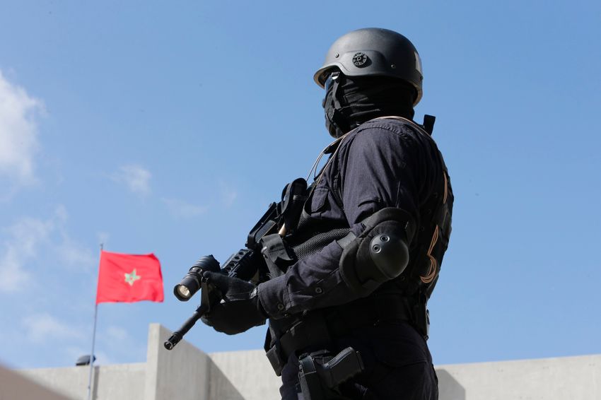 A Moroccan special anti-terror units guards the new headquarters of the Central Bureau of Judicial Investigations in Sale, near Rabat, Morocco, Monday April 20, 2015