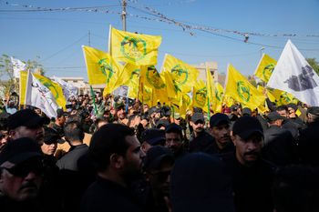 AP Photo/Hadi Mizban, File Members from the Popular Mobilization Forces attend the funeral of fighters from Kataib Hezbollah, who were killed in a U.S. airstrike in Babil province southwest of Baghdad, Iraq, July 31, 2024