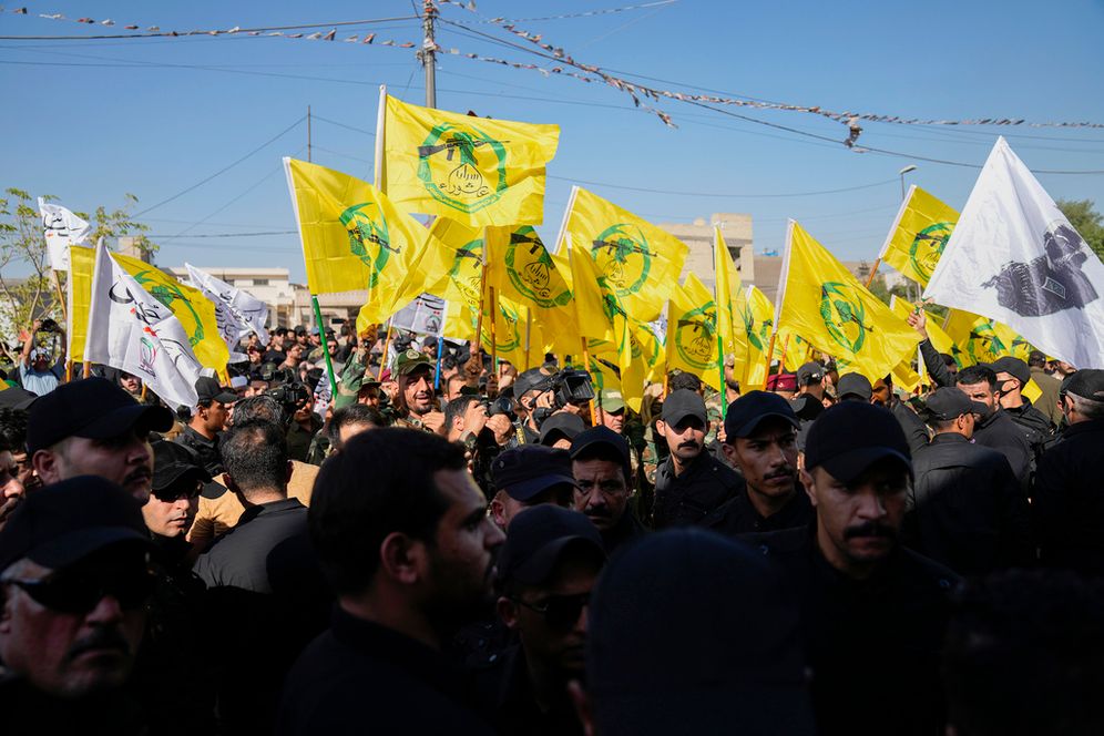 Members from the Popular Mobilization Forces attend the funeral of fighters from Kataib Hezbollah, who were killed in a U.S. airstrike in Babil province southwest of Baghdad, Iraq, July 31, 2024