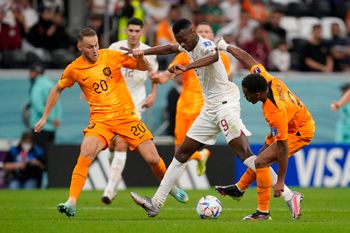 Qatar's Mohammed Muntari (C) fights for the ball with Netherlands' players, during the World Cup group A soccer match at the Al Bayt Stadium in Al Khor, Qatar, November 29, 2022.