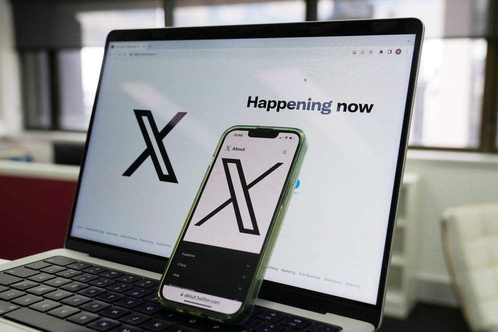 FILE - The opening page of X is displayed on a computer and phone, Oct. 16, 2023, in Sydney