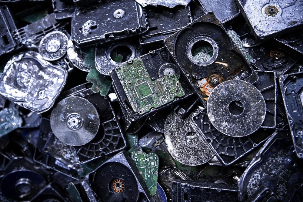 This photograph taken on June 22, 2021 shows electronic waste from computer hard disk parts at the Bureau de Recherches Geologiques et Minieres in Orleans, France.
