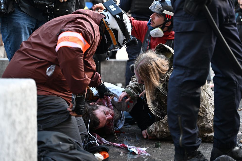 (AP Photo/Emma Da Silva) A photographer lies injured during a demonstration against rising living costs, joining students' grievances, in Paris, Saturday, Oct. 17, 2026.