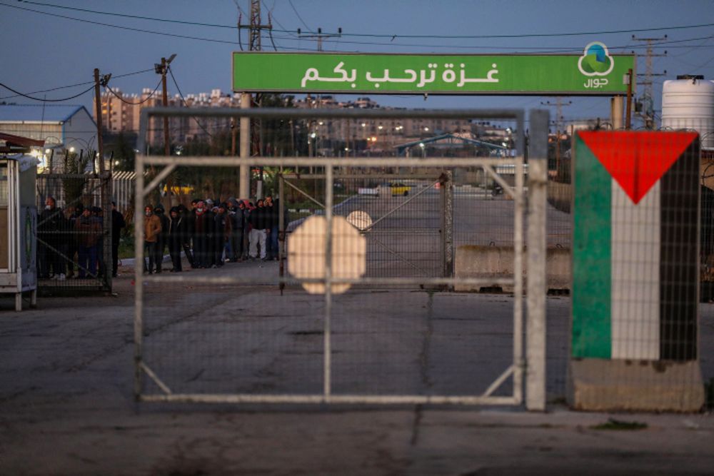 Palestinians wait at the Erez crossing in the northern Gaza Strip to enter Israel, on March 13, 2022.