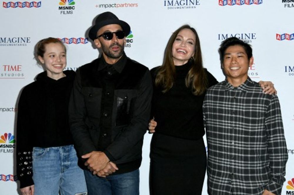 Shiloh Jolie-Pitt, street artist JR, actress Angelina Jolie and Pax Thien Jolie-Pitt