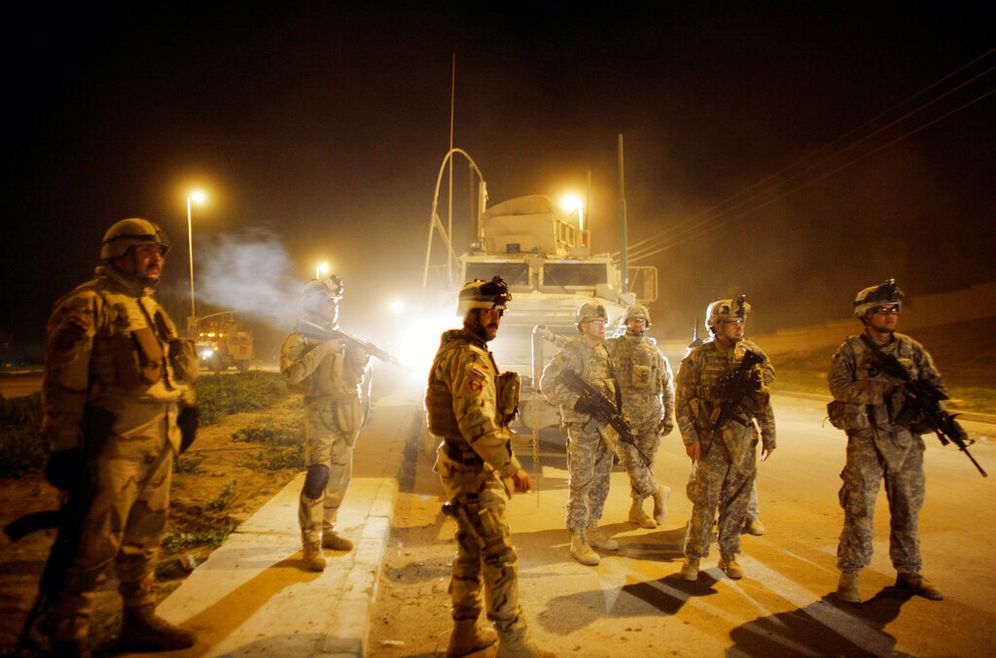 AP Photo/Maya Alleruzzo, File Illustration - U.S. Army soldiers and Iraqi Army soldiers in Mosul, north of Baghdad, Iraq.