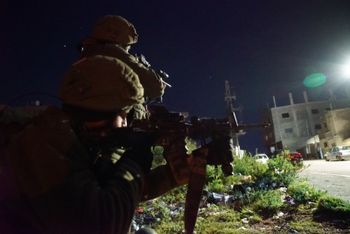 Israeli forces operate in the West Bank Tuesday night to capture the Palestinian suspected in the terror attack on Sunday, March 17, 2019 where two Israelis were killed.