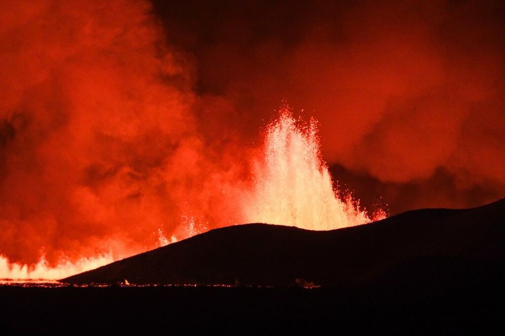 Flowing lava is seen during at a fissure on the Reykjanes peninsula 3km north of Grindavik, western Iceland on December 18, 2023.
