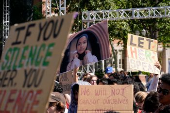 Students hold up a photo of University of Southern California 2024 valedictorian Asna Tabassum in protest to her canceled commencement speech on the campus of University of Southern California on Thursday, April 18, 2024.