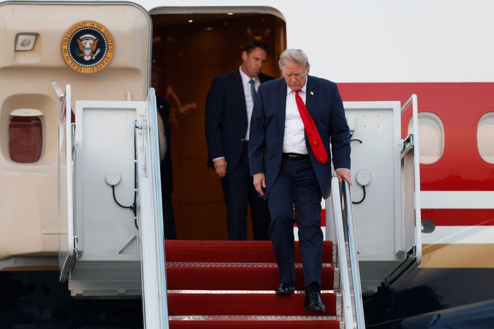 AP Photo/Luis M. Alvarez President Donald Trump walks down the stairs of Air Force One upon his arrival at Joint Base Andrews, Md., Sunday, July 19, 2026.