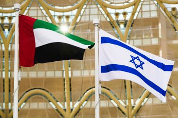 The Emirati (L) and Israeli flags fly in Dubai, United Arab Emirates.