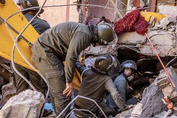 Rescue workers search for survivors in a collapsed house in Moulay Brahim, Al Haouz province, Morocco.