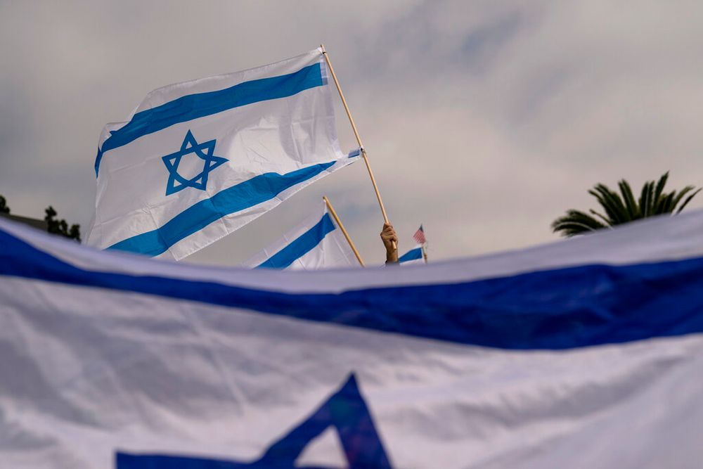 Demonstrators wave Israeli flags in Los Angeles, California, the United States.