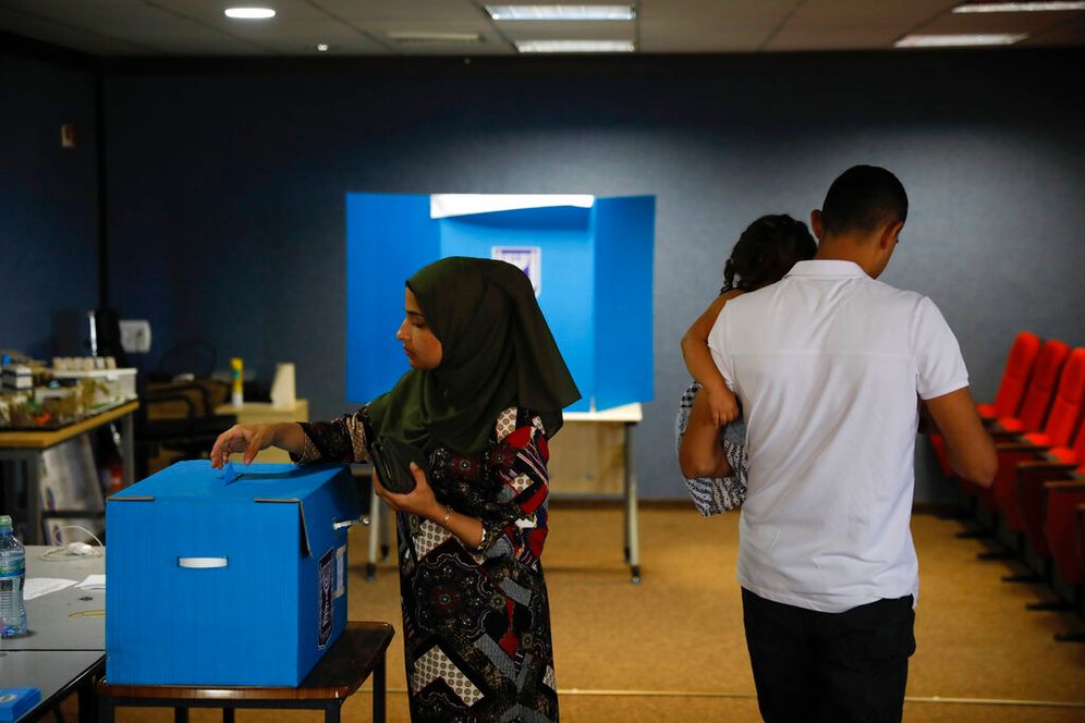AP Photo/Ariel Schalit A woman votes in Kfar Manda, an Arab town in Israel.