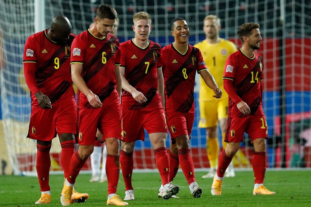 Belgium's Kevin De Bruyne, center, celebrates after scoring his side's fourth goal during the UEFA Nations League soccer match between Belgium and Denmark at the King Power stadium in Leuven, Belgium, Wednesday, Nov. 18, 2020.