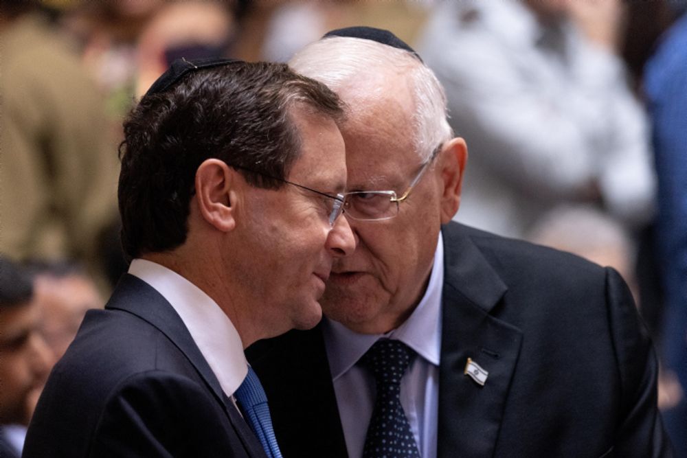 Israeli president Reuven Rivlin with Newly elected President Isaac Herzog at a state memorial ceremony at the National Memorial Hall at the entrance to the military cemetery on Mount Herzl, June 20, 2021.
