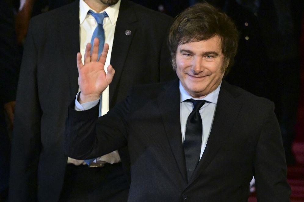 Argentina's new president Javier Milei waves as he leaves Teatro Colon after attending a lyrical gala during his inauguration day in Buenos Aires, Argentina.