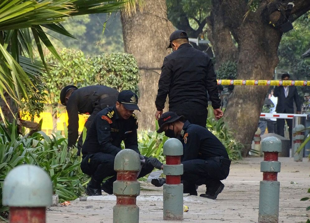 Indian National Security Guard soldiers inspect the site of a blast near the Israeli Embassy in New Delhi, India, on January 30, 2021.