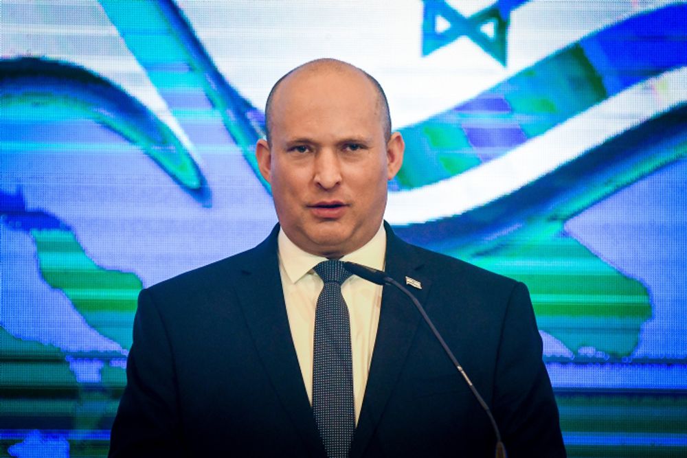Prime Minister Naftali Bennett speaks during a press conference in Jerusalem on December 7, 2021.