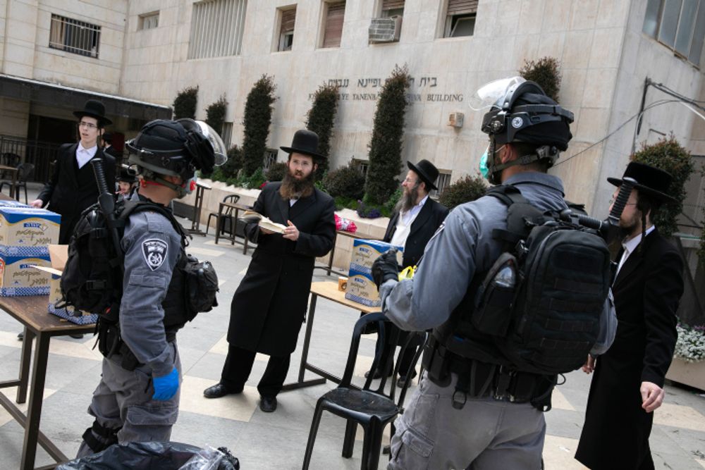 Israeli police officers at a synagogue in the Ultra-Orthodox Jewish neighborhood of Meah Shearim, Jerusalem, March 30, 2020