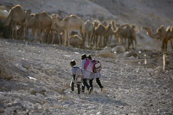 Palestinian Bedouin Students walk to their school at Khan al-Ahmar, near the west bank city of Jericho, Sunday, Sept 2. 2012