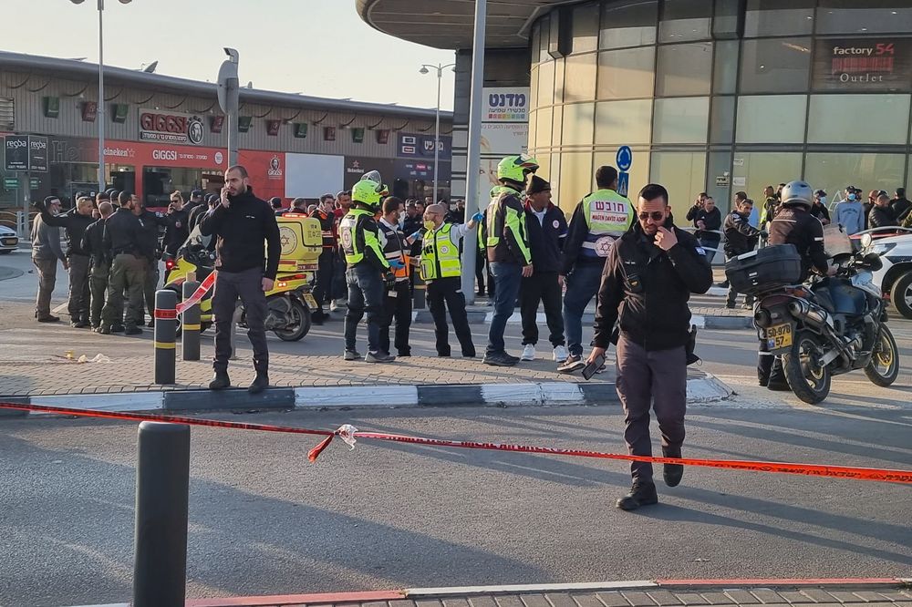 The scene of a car ramming and stabbing attack outside the big shopping center in Beer Sheva, southern Israel, on March 22, 2022.