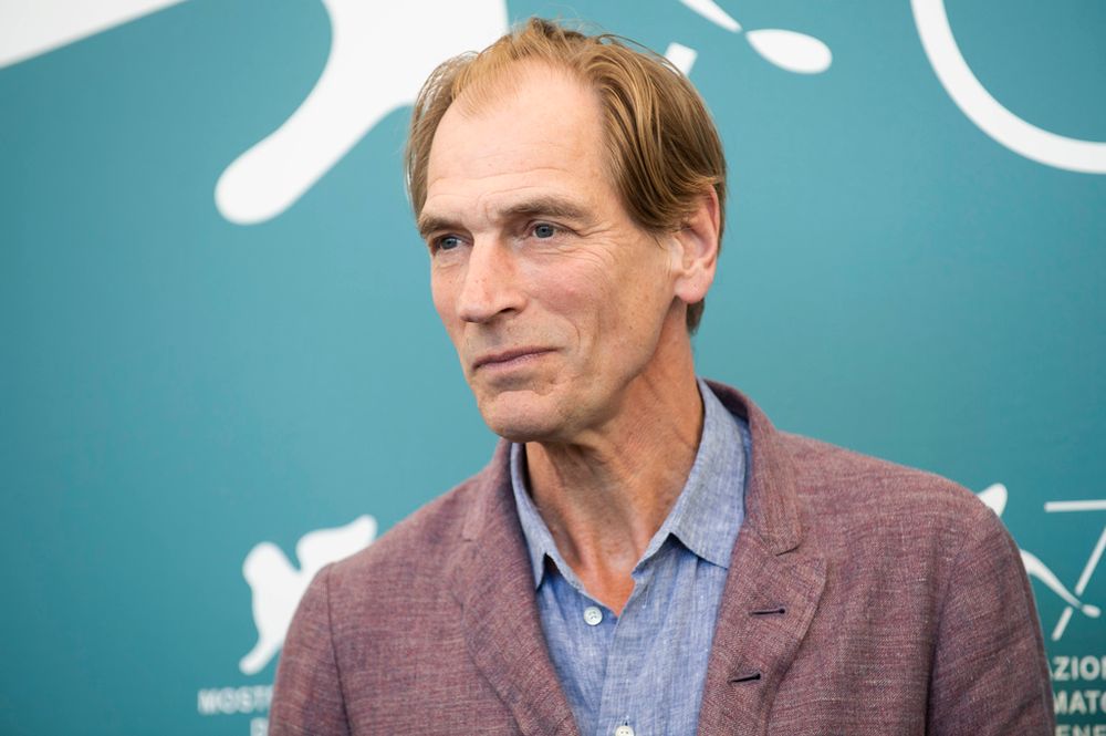 FILE - Actor Julian Sands poses for photographers at the Venice Film Festival in Venice, Italy.
