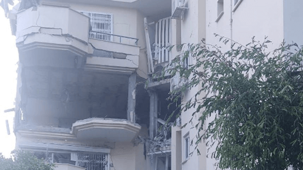 Un immeuble à Rehov frappé par un tir de roquette en provenance de Gaza, le jeudi 11 mai 2023