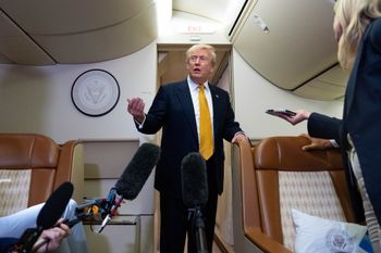 President Donald Trump speaks with reporters in flight on Air Force One after landing at U.S. Air Force Base at RAF Mildenhall, in Suffolk, Eastern England, Wednesday, July 8, 2026. 
