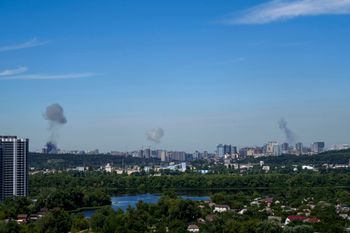 Smoke rises over the Kyiv skyline after a Russian attack