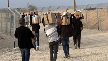 Gazans seen receiving boxes of aid