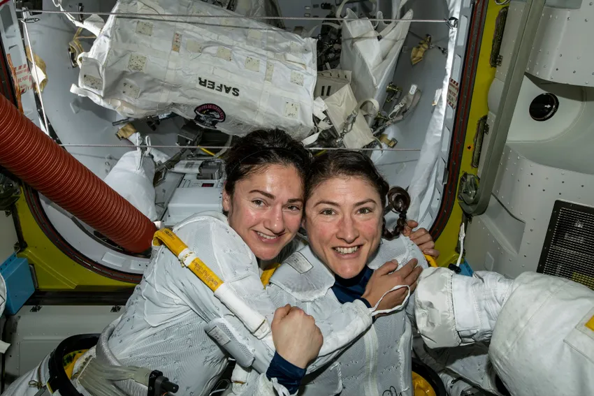 In this photo released by NASA on Friday, Oct. 18, 2019, U.S. astronauts Jessica Meir, left, and Christina Koch pose for a photo in the International Space Station.