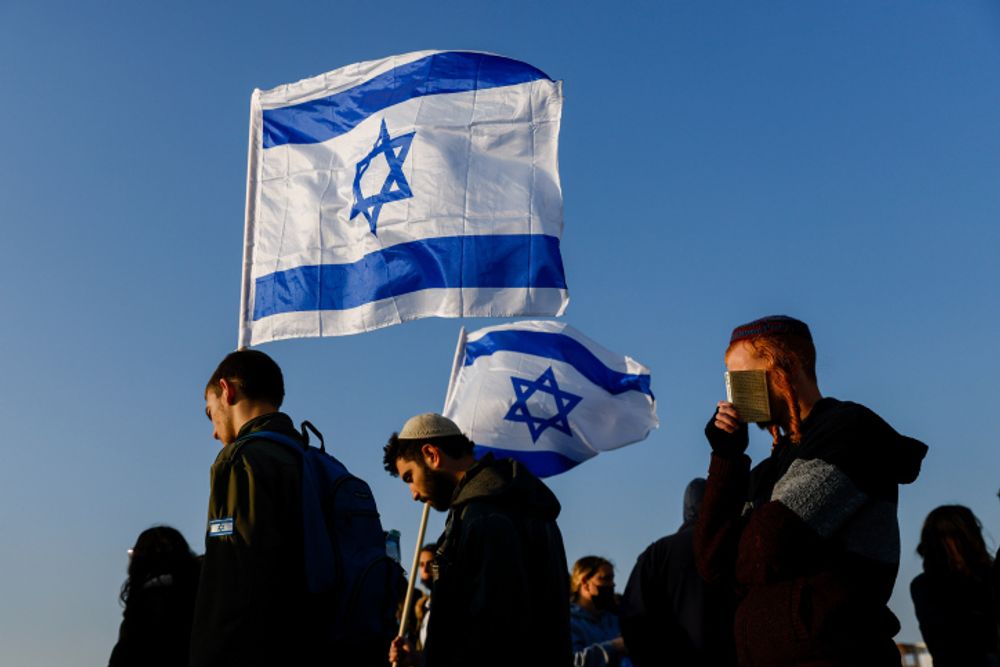 Mourners attend the funeral of 67-year-old Menahem Yehezkel, murdered in a terror attack, at the cemetery in Be'er Sheva, southern Israel, on March 23, 2022.