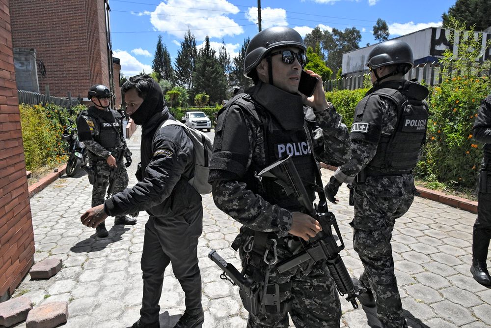 Police stand guard before the funeral of slain presidential candidate Fernando Villavicencio in Quito, Ecuador