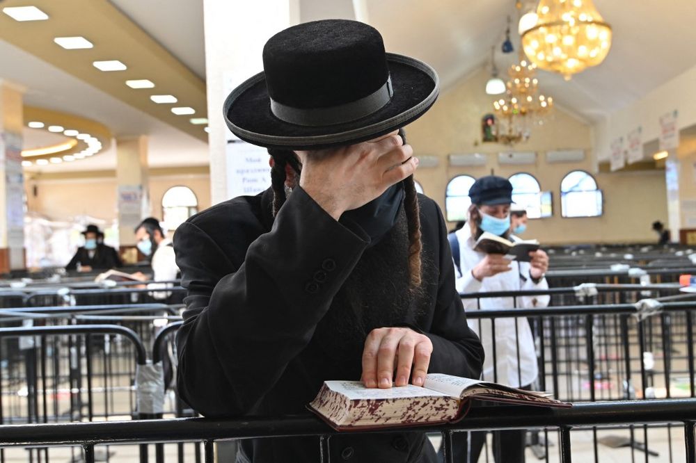 Hasidic Jews wearing visit the tomb of Rabbi Nahman, the founder of the Breslov Hasidic movement, days before the Jewish New Year in the town of Uman in central Ukraine on September 16, 2020.