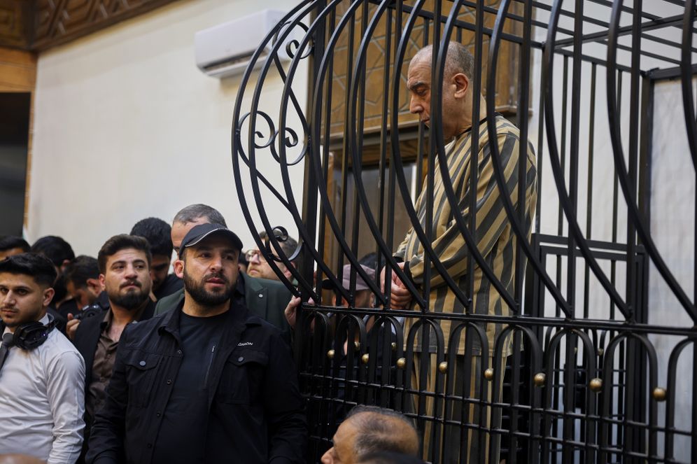 (AP Photo/Ghaith Alsayed) FILE -Atef Najib, former head of the Political Security Branch in the Daraa area during Bashar Assad's rule, sits in the defendants' cage during a trial session at the Palace of Justice in Damascus, Syria, April 26, 2026.