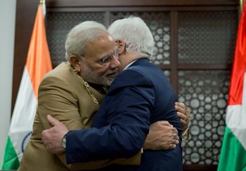 Palestinian President Mahmoud Abbas, right hugs Indian Prime Minister Narendra Modi, Feb. 10, 2018