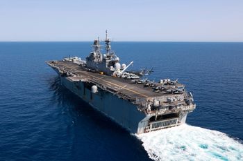 In this photo released by the U.S. Navy, the amphibious assault ship USS Bataan travels through the Red Sea.