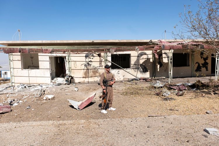 Kurds inspect the aftermath of a bombing in the village of Zrgoiz, near Sulaymaniyah, Iraq, where the bases of several Iranian opposition groups are located, on September 28, 2022.